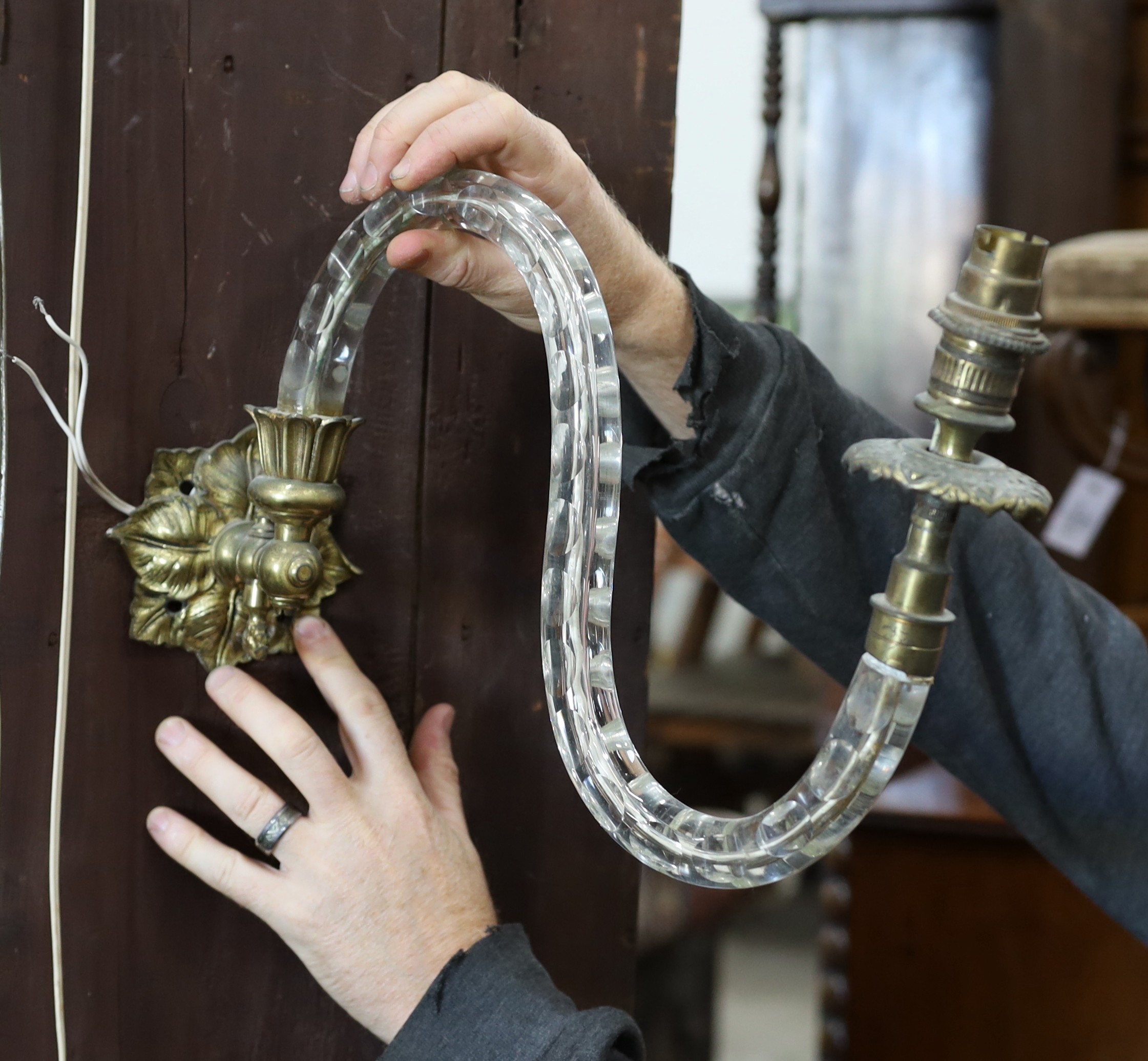 Five pairs of gilt metal and glass two branch wall lights, largest 33cm
